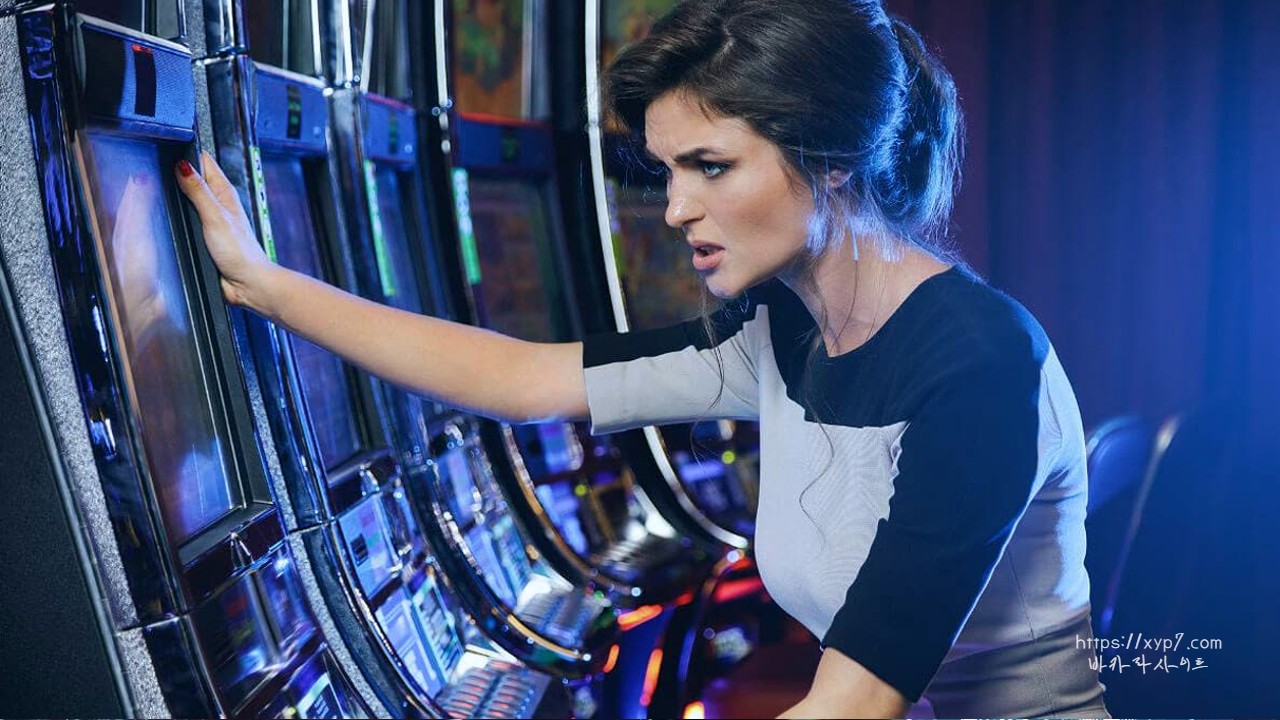 Woman frustrated in front of slot machin